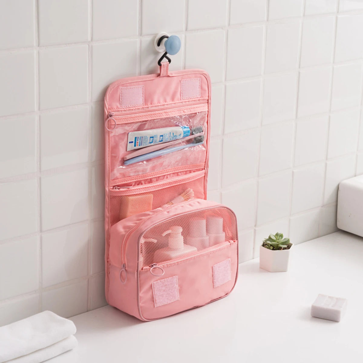 A multi-functional travel bag that can be hung with dry and wet separation, a hand-held toiletry and storage bag, one set